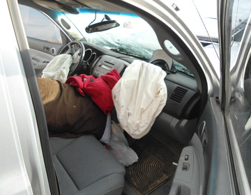 Deployed airbags in car