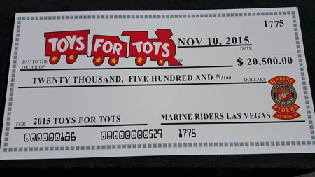 Check for Toys for Tots at charity event