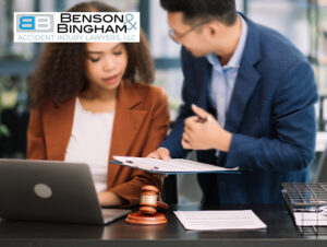 Attorney discussing a Nevada Injury Claim with a client at Benson Bingham office.