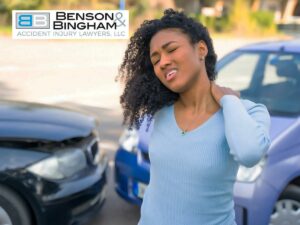 Woman feeling neck pain after car accident, highlighting the need for medical documentation