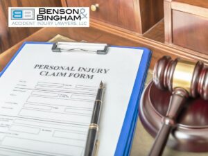 Nevada injury lawyer's office with a personal injury claim form and a gavel on a wooden desk, symbolizing legal assistance for personal injury cases