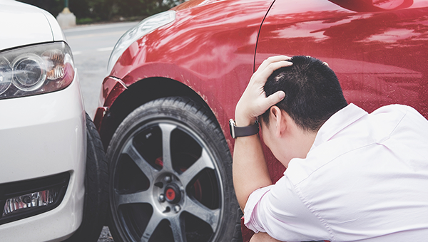 Minor Car Accident Between White and Red Car