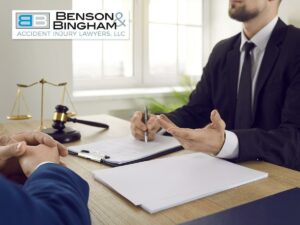 Consulting with a lawyer to discuss a Workers' Compensation claim during a legal meeting