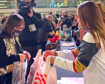 Volunteers Handing Bag OF Toys To