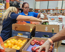Volunteers At Three Square Organizing Food
