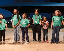 Group Of Girls Of Different Ages Standing In Line
