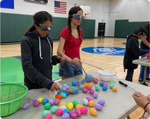 Two Girls Playing Games With Colorful Balloons
