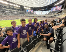 Group Of Children At A Football Game