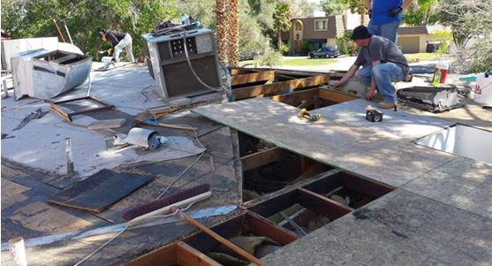 Volunteers Helping Rebuild a Roof
