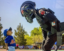 Volunteer In Costume Having A Stare-Off With A Small Child
