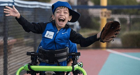 Happu Child Using A Frame Runner To Complete A Baseball Run