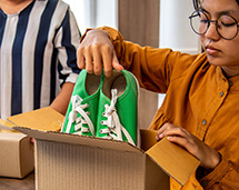Volunteers Packing Pre-Owned Shoes For Donation