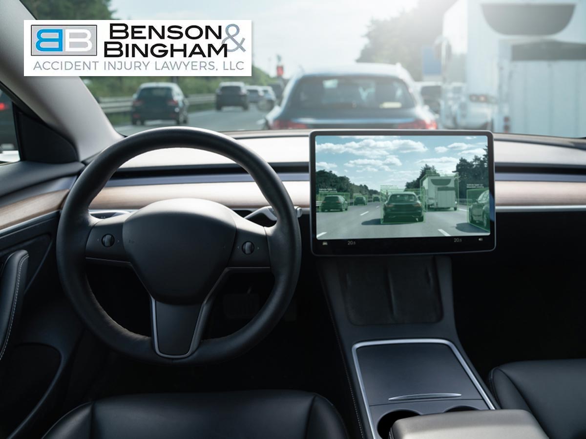 Interior of a Tesla with self-driving screen showing traffic ahead