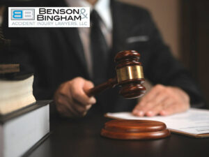 Attorney with gavel in hand, representing legal matters related to Nevada’s AB 523 Lowers Rideshare & Delivery Company Liability To $1 Million