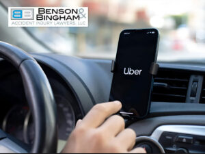 Uber app open on phone in a car, symbolizing the impact of Nevada’s AB 523 Lowering Rideshare & Delivery Company Liability To $1 Million for injury victims