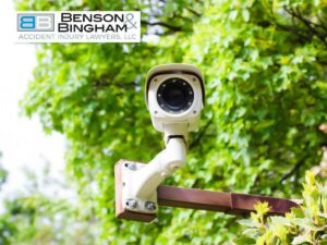 A security camera in a green outdoor setting, illustrating the importance of Copyright & Trademarks in PI marketing and evidence.
